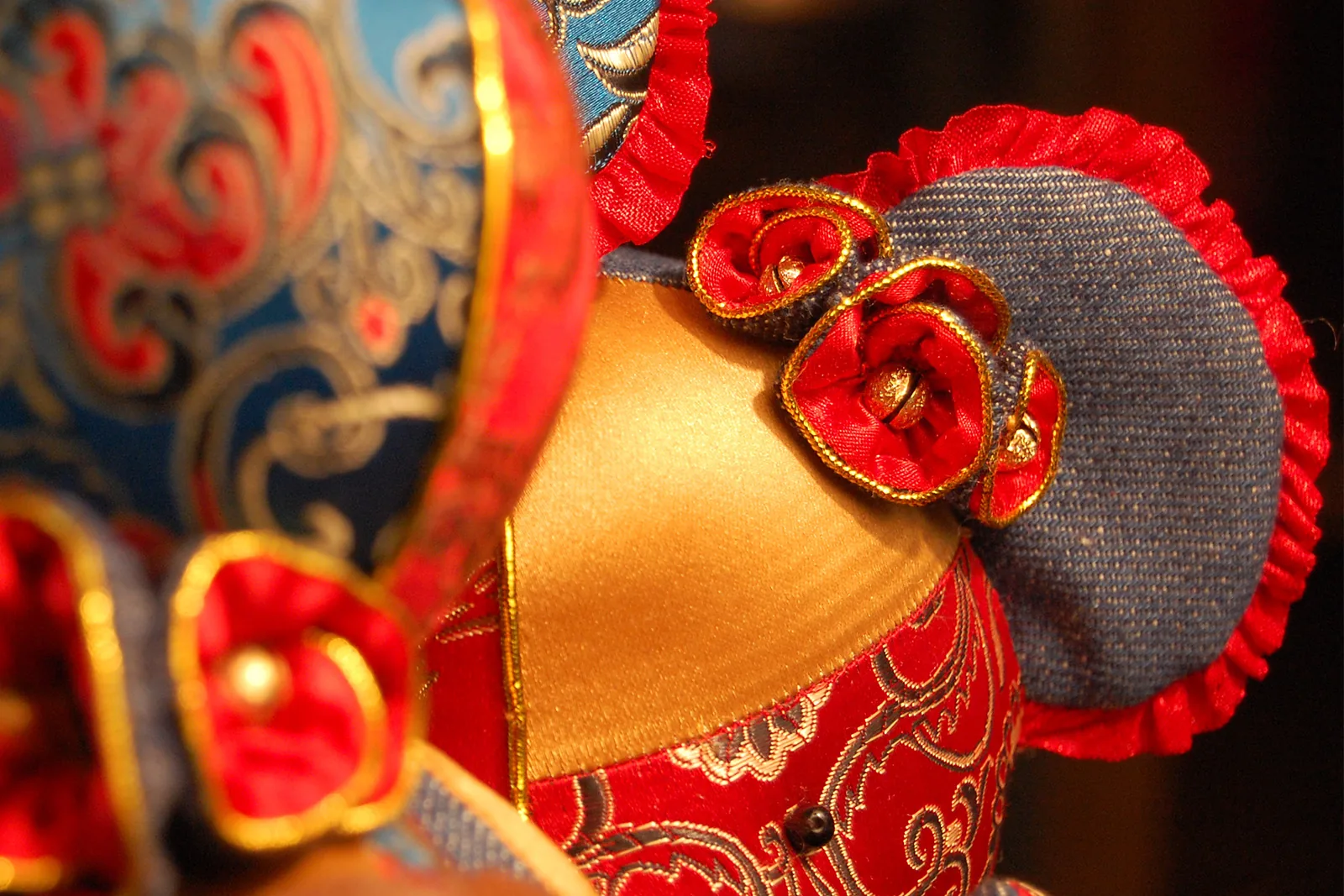 A close view of the dragon and phoenix bear textiles