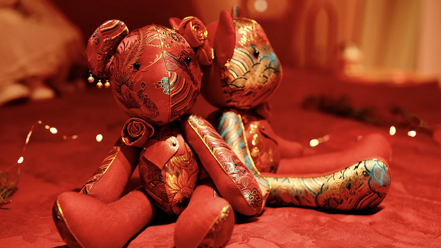 A red wedding textile detail from the archive pair